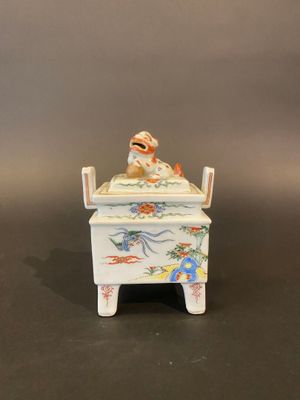 a figurine of a man in a bed with a dog on it