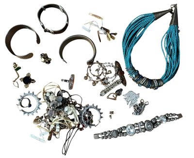 many different types of jewelry on a white surface