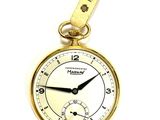 a gold pocket watch with a chain hanging from it
