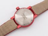 an image of a close up of a wrist watch on a white surface