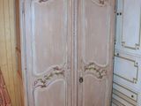 a large armoire in the corner of a room