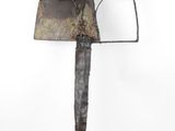 sculpture of a knife with a large blade on top of it