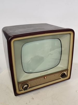 an old fashioned television sitting on top of a table