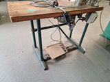 a sewing machine sitting on top of a wooden table