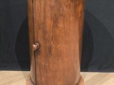 an old wooden cabinet with a marble top on a wooden floor