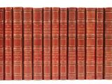 a row of red books sitting on top of each other