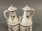 two white and blue vases with flowers on them