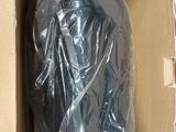 a cardboard box with a bag in it that is wrapped in plastic