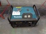 a small generator that is sitting on the ground