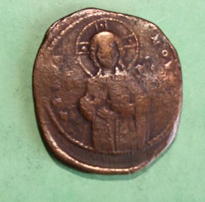 an old coin with a picture of a person on it
