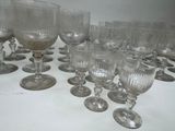 a lot of wine glasses sitting on a table