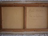 an old picture of a picture frame with writing on it