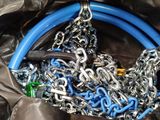 a bunch of blue and silver chains on a black bag