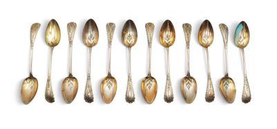 six spoons are lined up in a row on a white surface