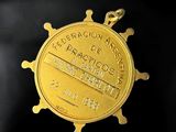 an image of a gold medal on a black background