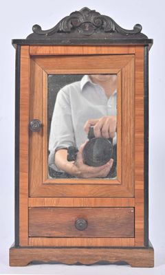 a man taking a picture of himself in a mirror