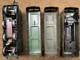 three different types of toy trains sitting on the floor