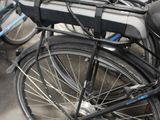 many bikes that are parked next to each other