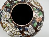 a vase that has a design on the inside of it