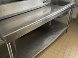 a large stainless steel sink in a commercial kitchen