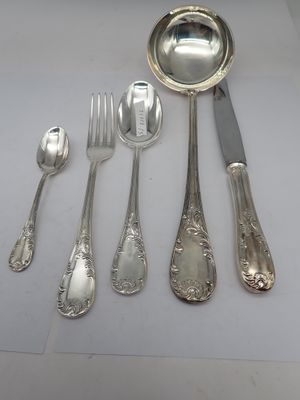 a lot of silver spoons and spoons on a table
