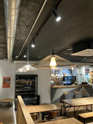 a restaurant with tables and benches in the middle of the room