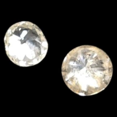two white diamonds on a black background with a black background