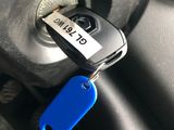 a car key that is attached to a car key holder
