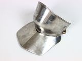 a close up of a metal object on a white surface
