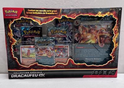 the box of the pokemon card game is open and ready to be played