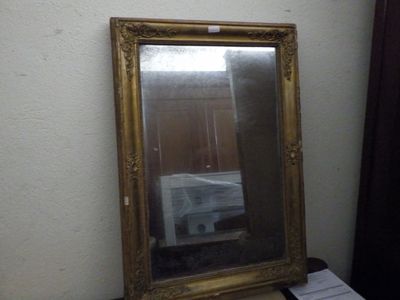 a mirror that is sitting on a table next to a window