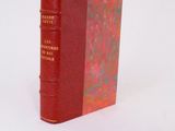 a red book that is sitting on a white surface