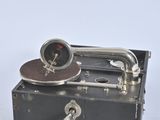 a black box with a clock on top of it