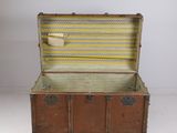 an old suitcase is open on a white surface with a tag on it