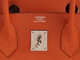 hermes ' s orange leather tote bag with silver hardware
