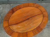 a wooden plate sitting on the ground outside