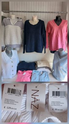 beaucoup de vêtements exposés dans un magasin