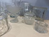 a table with a lot of glass items on it