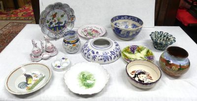 a table with a lot of different bowls and plates on it
