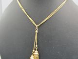 a close up of a necklace on a mannequin mannequin