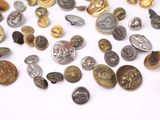 many different types of buttons on a white surface