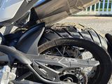 a motorcycle that is parked in the gravel