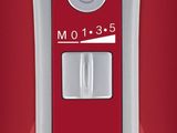 a close up of a red and white computer mouse