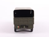 a toy army truck with a flag on the back of it