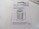 a manual for a blender that is on the table
