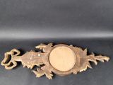 an antique brass plate with a dragon design on it