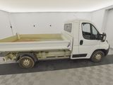 a white truck that is parked in a garage
