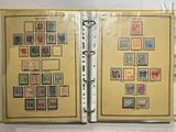 an open book with a bunch of stamps on the pages