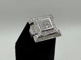 an image of a diamond ring on a black stand
