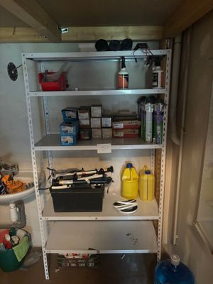 a shelf that has a lot of items on it